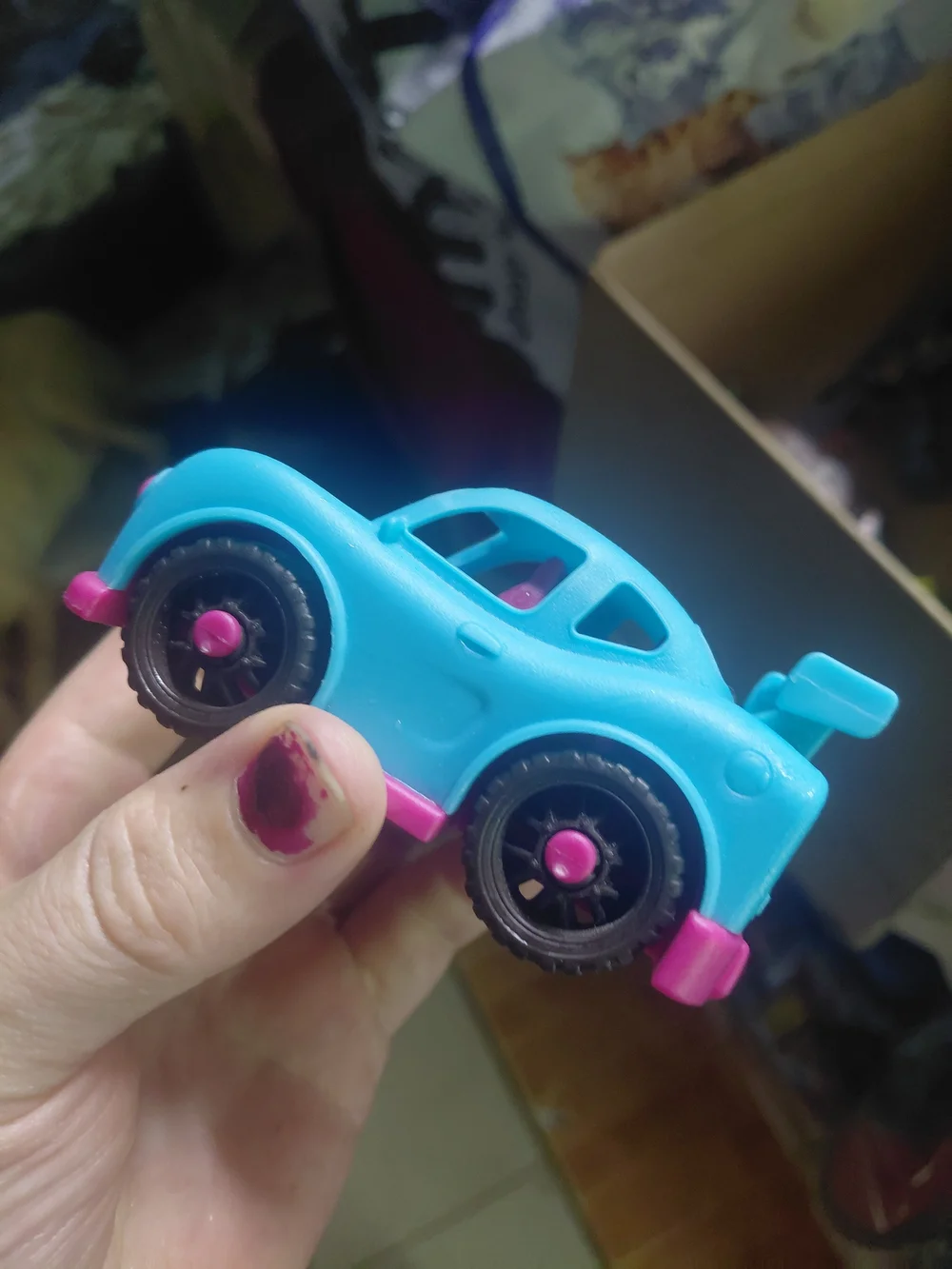 B. toys Happy Cruisers mini race car featuring a vibrant blue body with contrast
